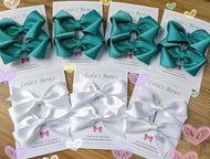 White Exam Bows